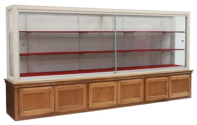 Appraisal: Large display and storage cabinet white painted wood display case