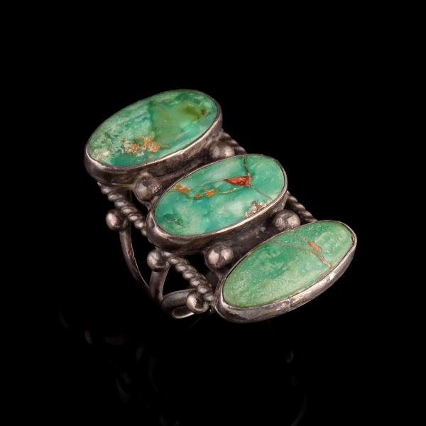 Appraisal: A LARGE MAN'S STERLING SILVER AND TURQUOISE RINGThe triple band