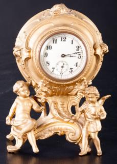 Appraisal: Cherub Clock French-style gilt figural clock with round case flanked