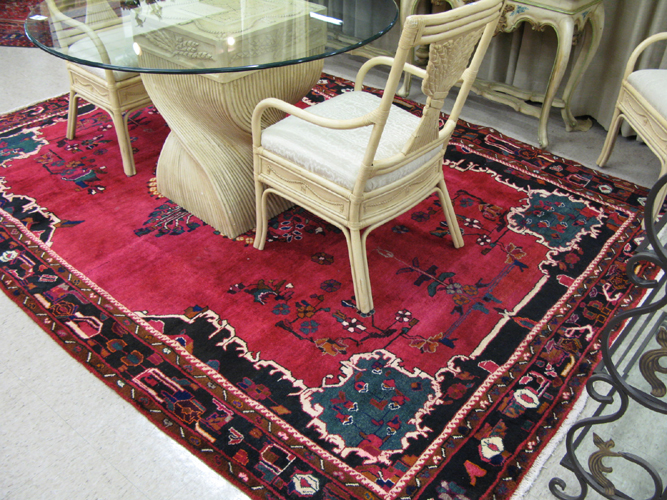 Appraisal: PERSIAN HAMADAN CARPET centering a cluster of colorful flowers on