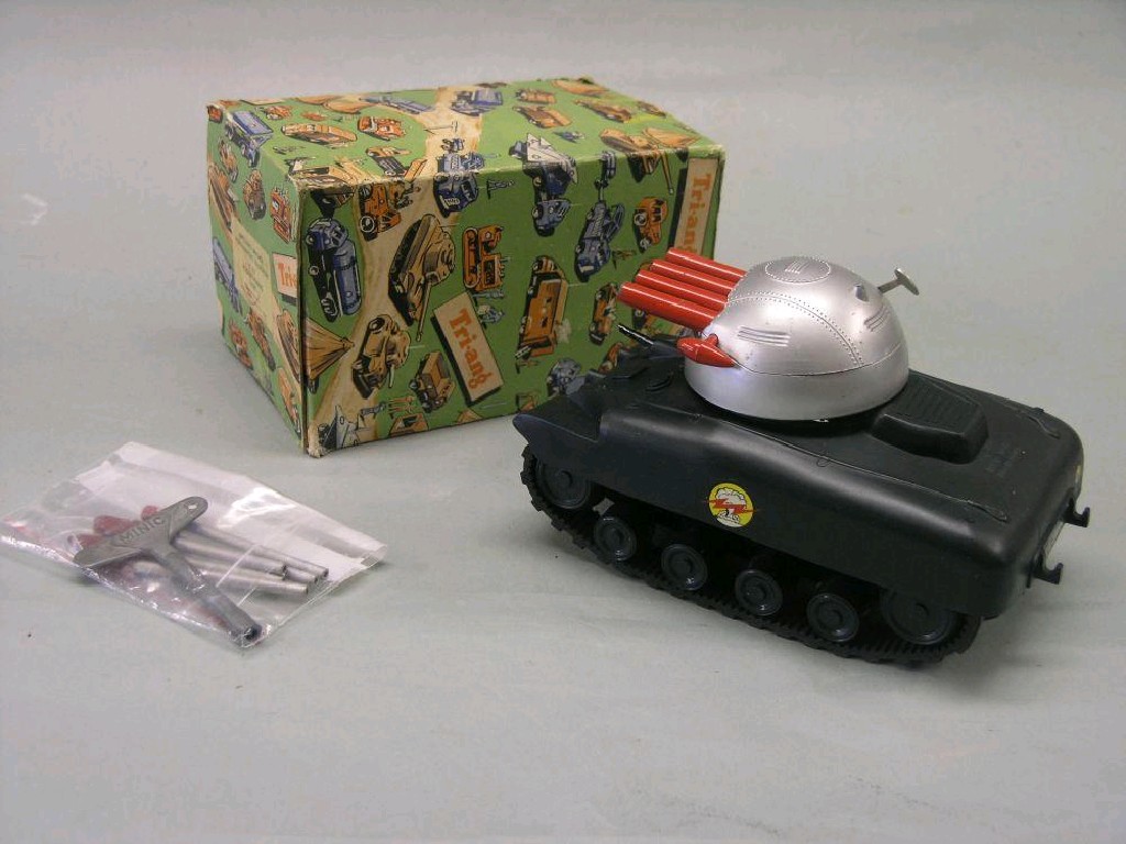 Appraisal: A Tri-Ang Minic tank rocket firing with clockwork motor rubber