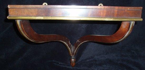 Appraisal: A th Century mahogany clock bracket raised a two serpentine