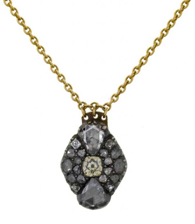 Appraisal: AN ANTIQUE DIAMOND PENDANT centred by a cushion shaped pale