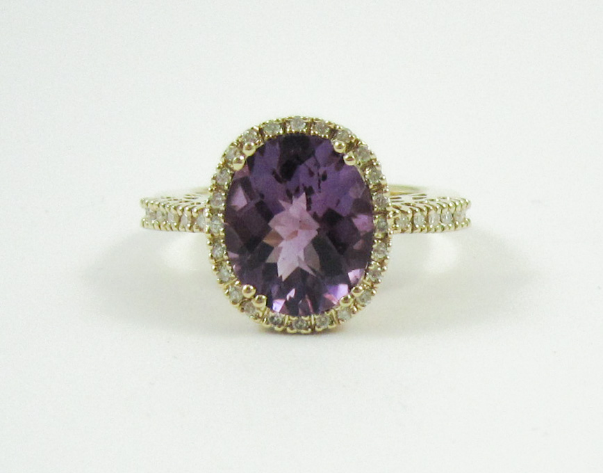 Appraisal: AMETHYST DIAMOND AND FOURTEEN KARAT GOLD RING with round-cut diamonds