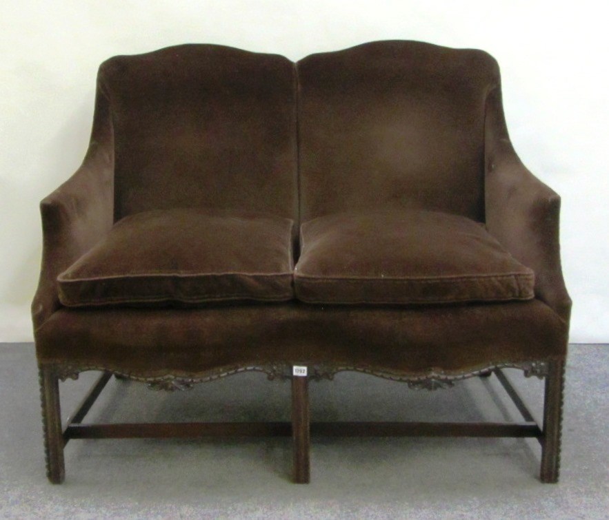 Appraisal: A mid th century style small sofa with double hump