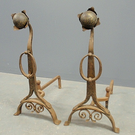 Appraisal: - Pair of wrought iron sunflower andirons in the manner