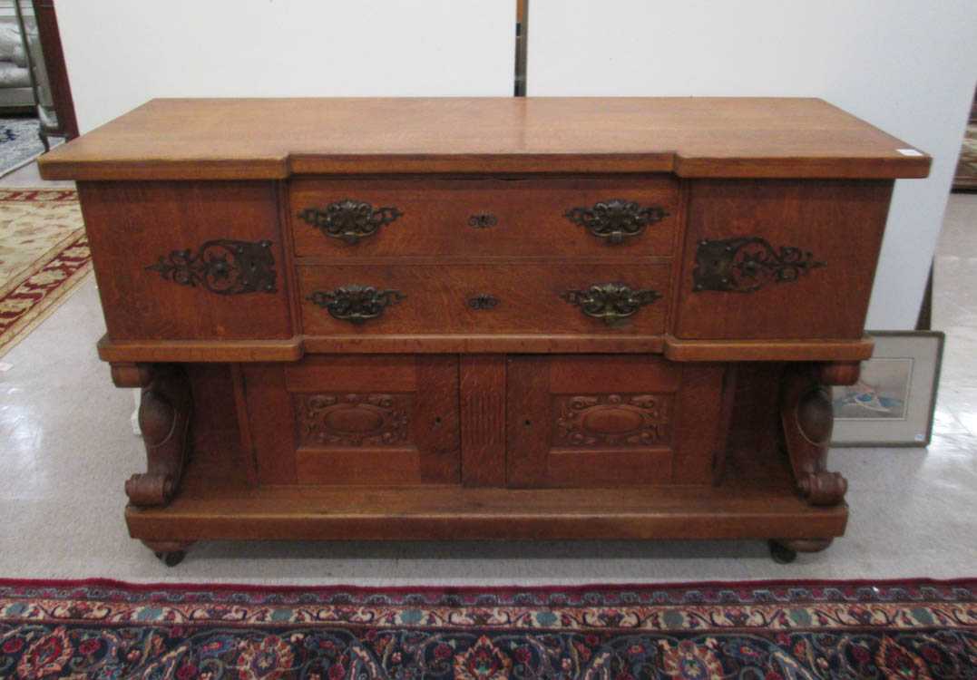 Appraisal: LARGE OAK SIDEBOARD American c the front presenting four cabinet