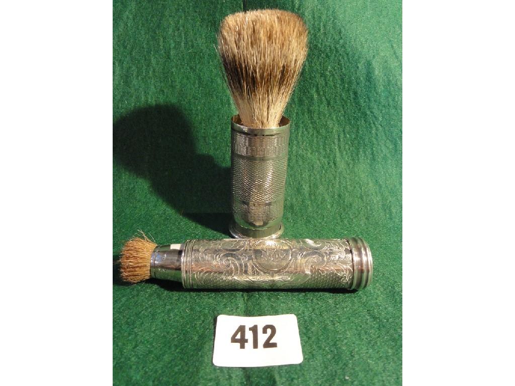 Appraisal: Two silver gentleman's shaving brushes with engine turned decoration both