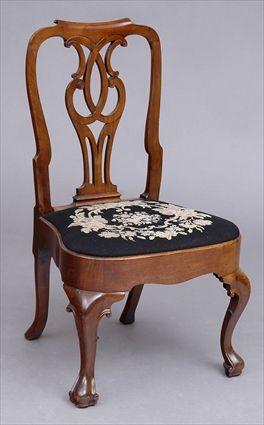 Appraisal: GEORGE II CARVED MAHOGANY SIDE CHAIR The dipped top rail