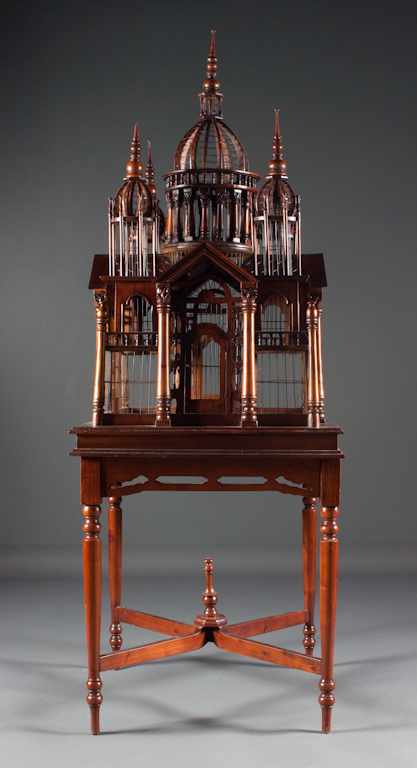 Appraisal: Victorian style carved teakwood and wire palace-form birdcage on similar