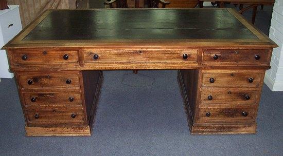 Appraisal: An early Victorian mahogany partners' desk fitted a surround of