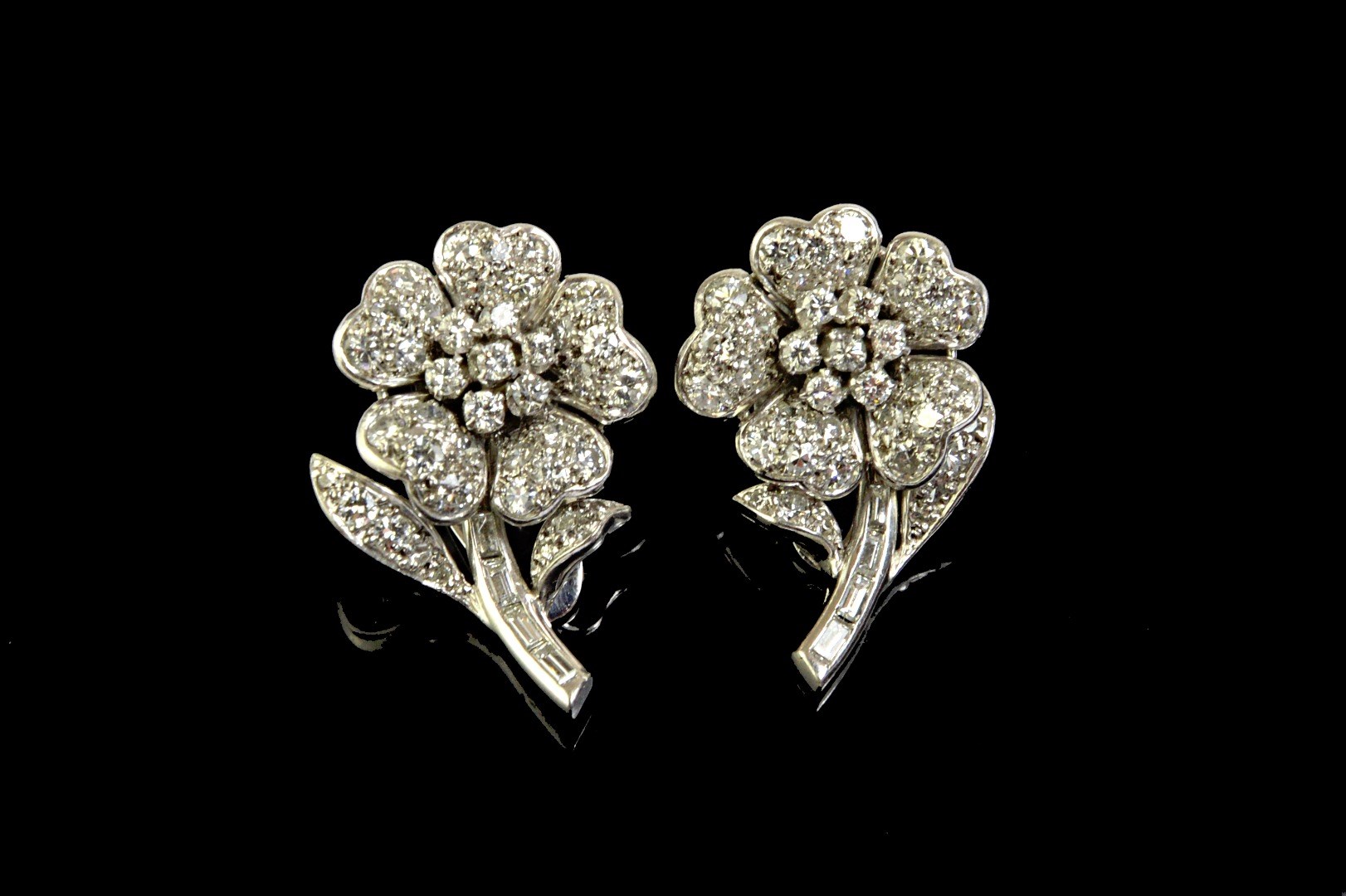 Appraisal: A pair of diamond set earclips each designed as a