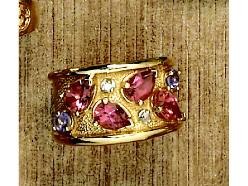 Appraisal: PINK TOURMALINE AND TANZANITE RING k yellow gold band ring