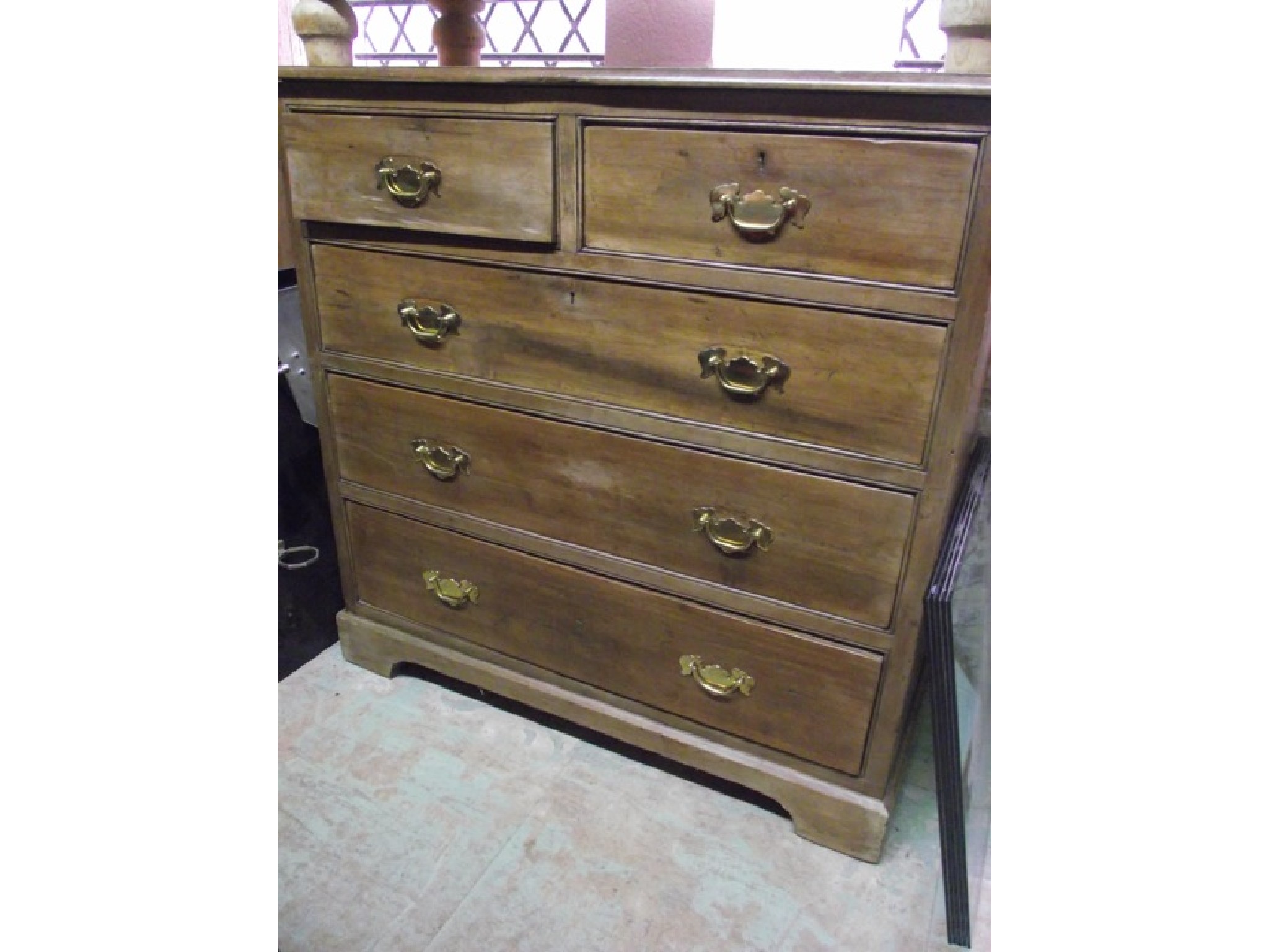 Appraisal: An Edwardian walnut and pine bedroom chest of three long