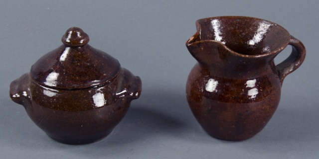 Appraisal: Jug Town Redware PotteryCovered sugar and creamer in tobacco spit