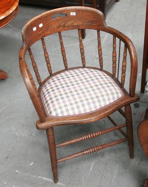 Appraisal: An oak Captain's chair together with a Bent cane armchair