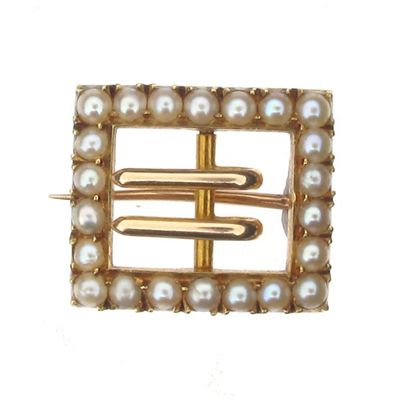 Appraisal: An Edwardian gold small buckle brooch Set with seed pearls