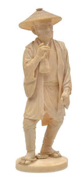 Appraisal: A JAPANESE IVORY OKIMONO OF A FARMER MEIJI PERIOD TH