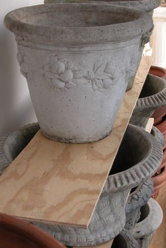 Appraisal: Collection of Decorative Outdoor Composition Planters with garland reliefs or