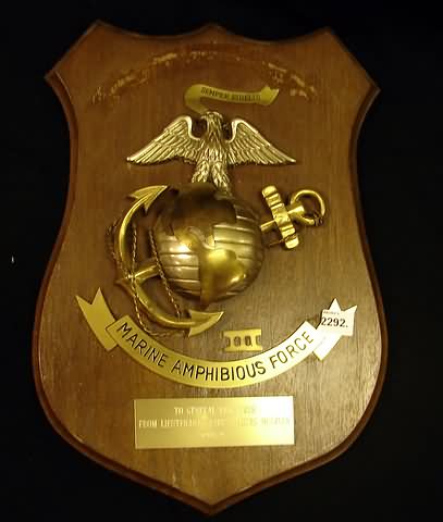 Appraisal: Medal on wood presentation plaque featuring Marine Corps globe anchor