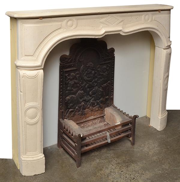 Appraisal: A COMPOSITE STONE FIRE SURROUND the rounded rectangular mantel piece