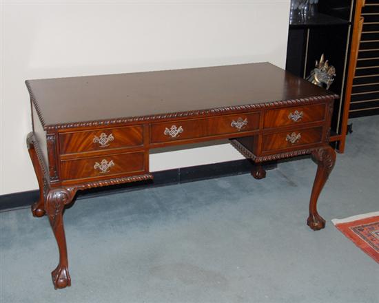 Appraisal: A Mahogany Georgian-style Flat Top Desk with gadroon molding to