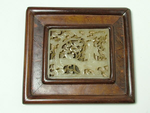 Appraisal: A Chinese celadon jade rectangular panel carved with a male