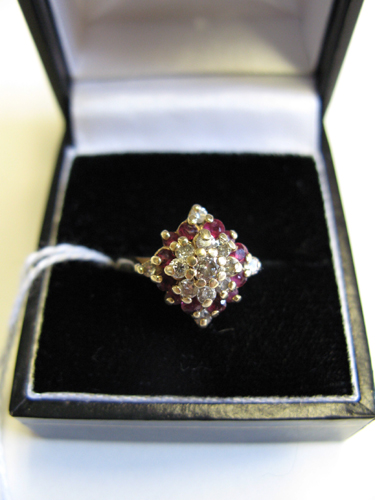 Appraisal: RUBY DIAMOND AND FOURTEEN KARAT GOLD CLUSTER RING set with