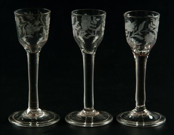 Appraisal: Three engraved plain-stemmed wine glasses the ogee bowls engraved with