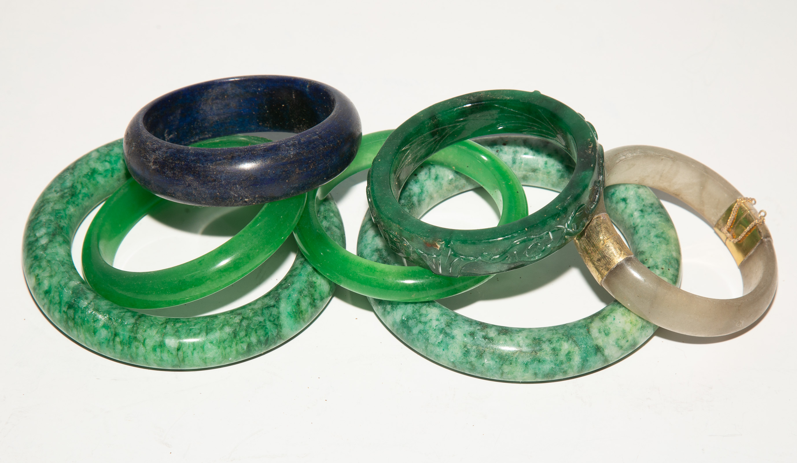 Appraisal: A GROUP OF CHINESE HARDSTONE BANGLES th century