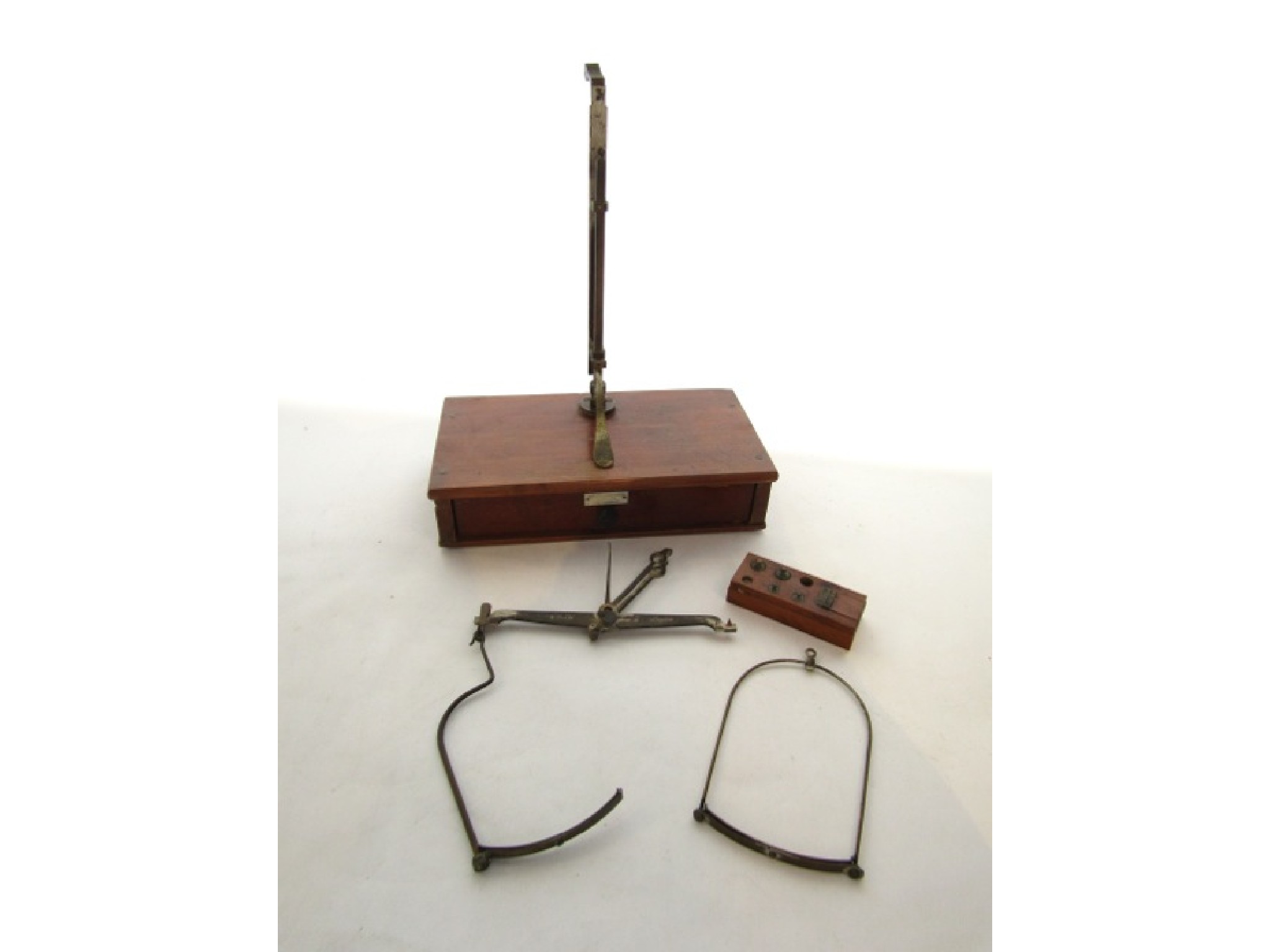 Appraisal: A set of travelling balance scales in a mahogany case