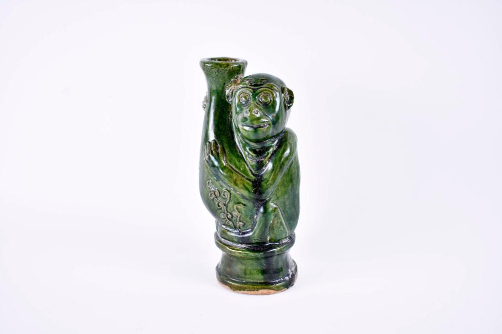 Appraisal: CHINESE GREEN GLAZED POTTERY VESSELIn a Tang Dynasty style In