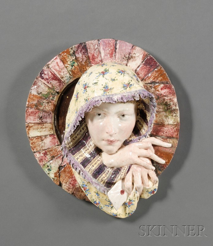 Appraisal: Earthenware Wall Plaque of a Girl th century polychrome enamel