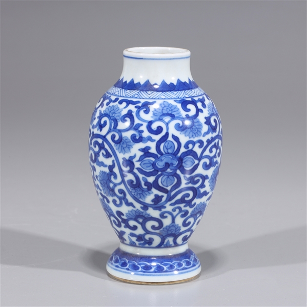 Appraisal: Small Chinese blue and white vase with allover floral designs