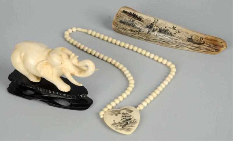 Appraisal: Lot of Ivory Pieces Includes one elephant on wooden stand