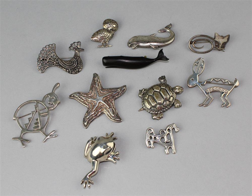 Appraisal: COLLECTION OF TEN STERLING ANIMAL PINS AND A HAND CARVED