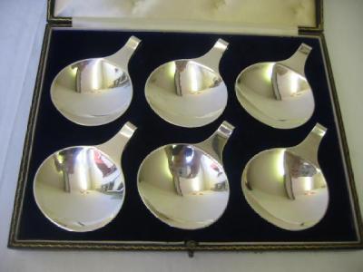 Appraisal: A SET OF SIX BUTTER DISHES of circular form with