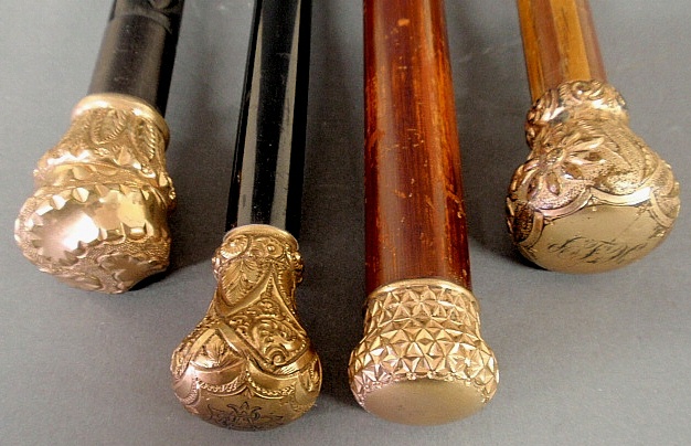 Appraisal: - Four late th c walking sticks with gold-filled handles