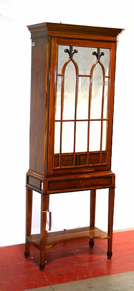 Appraisal: A Neoclassical style parcel ebonized walnut curio cabinet height ft