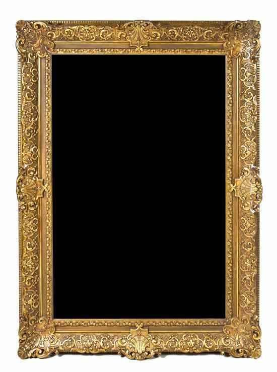 Appraisal: A Giltwood Over Mantel Mirror having a rectangular beveled plate