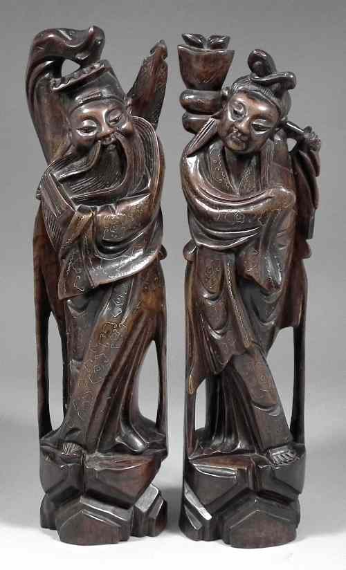 Appraisal: A pair of Chinese hardwood carvings of Sages inlaid with