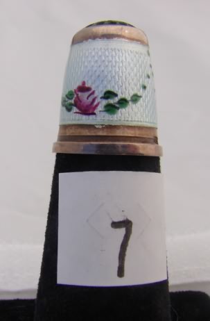 Appraisal: Enamel floral sterling band thimble with green stone top