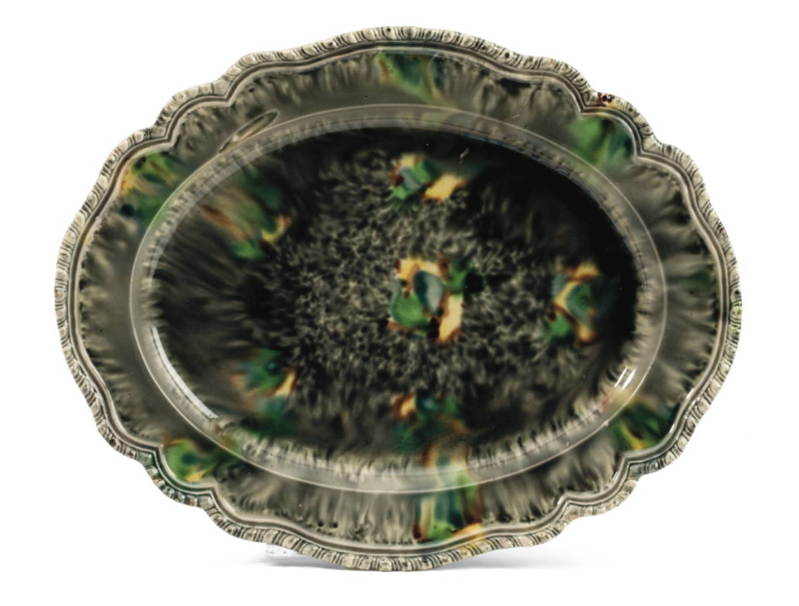 Appraisal: STAFFORDSHIRE CREAMWARE TORTOISESHELL-GLAZED OVAL PLATTER CIRCA - Sprinkled and streaked