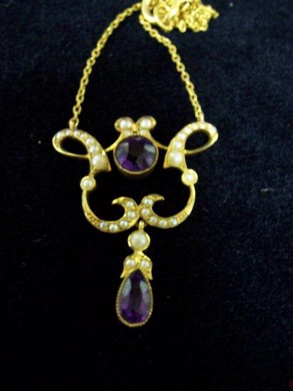 Appraisal: A kite shaped pendant half pearl set and with amethyst