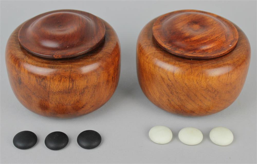 Appraisal: PAIR OF CHINESE HUANGHUALI WEIQI BOXES AND COVERS each formed