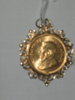 Appraisal: A GOLD KRUGERRAND in pendant frame