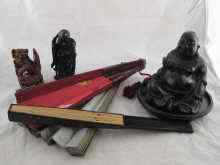 Appraisal: A carved wood Buddha with metal inlay ht cm signed