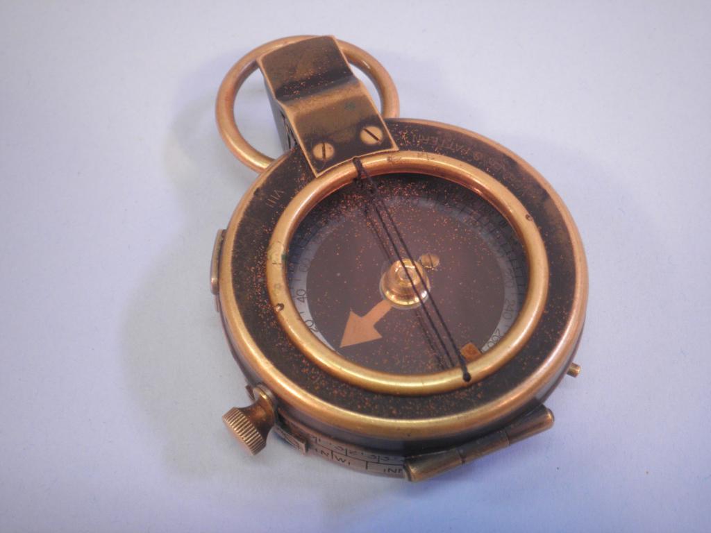 Appraisal: A World War I brass compass dated to the reverse