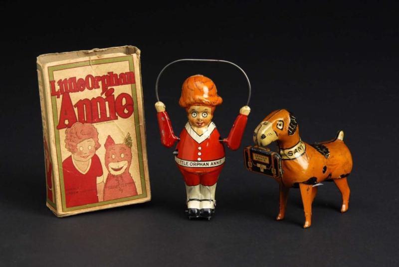 Appraisal: Tin Marx Little Orphan Annie Sandy Toys Description American Both