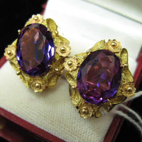 Appraisal: PAIR OF AMETHYST AND FOURTEEN KARAT GOLD SOLITAIRE EAR CLIPS